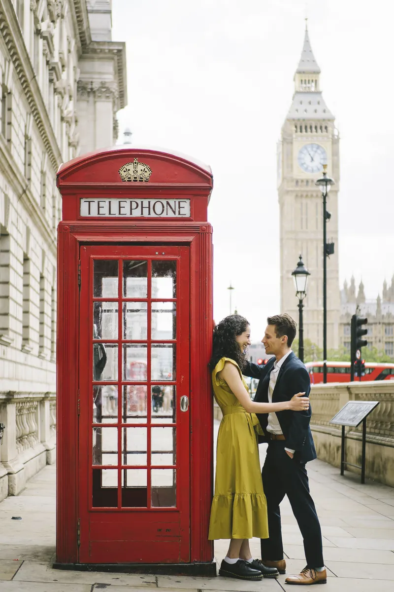 Parmida and Jake beside a red London telephone box