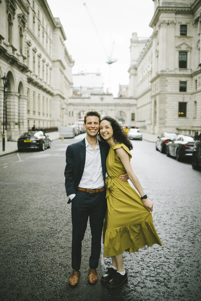 Parmida and Jake smiling together on a London street